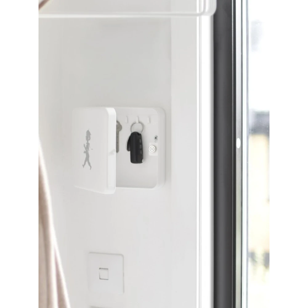 aelgmark white wall-mounted key box with a silhouette of a running boy, holding keys inside.