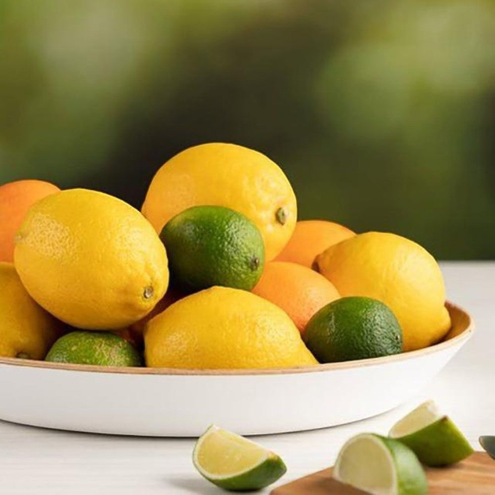 aelgmark white-rimmed willow wood serving tray with lemons and limes