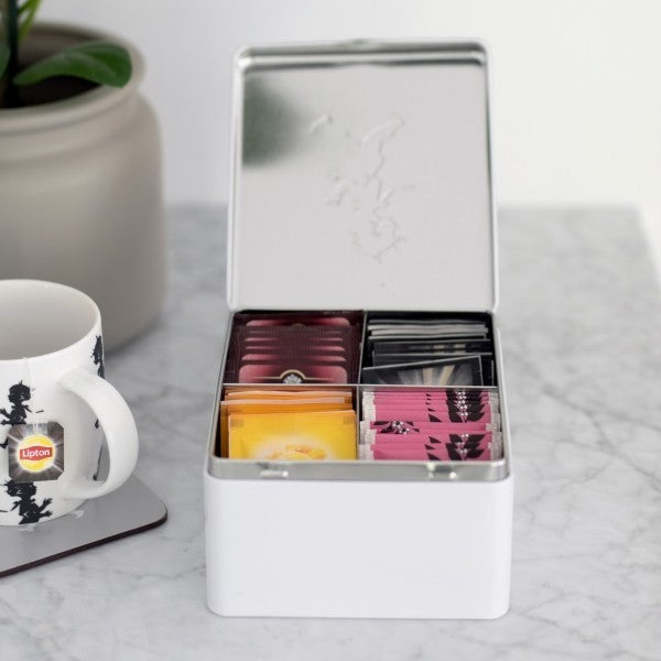 aelgmark white tin tea bag organizer with four compartments, featuring classic SOLSTICKAN artwork on the lid.