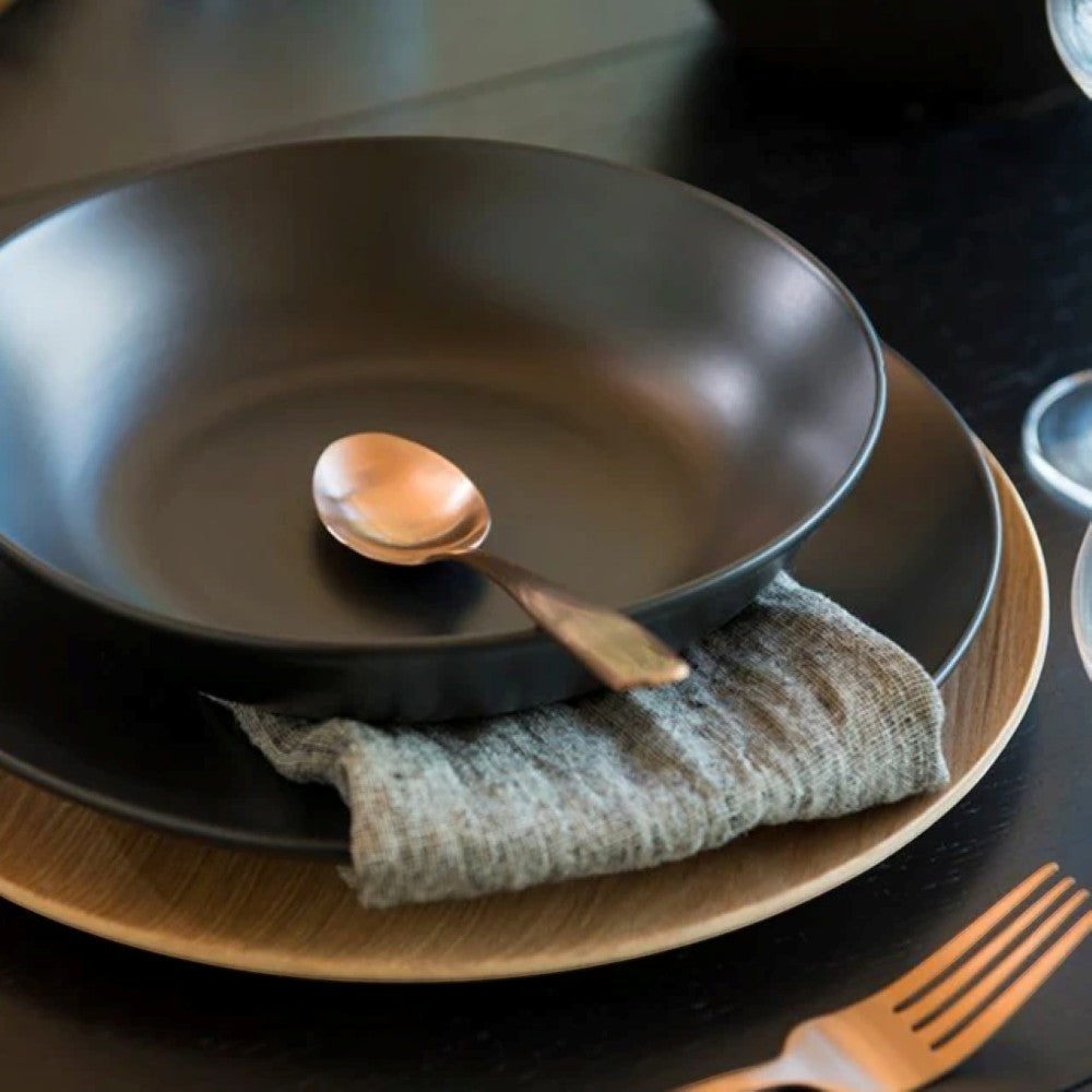aelgmark wooden round serving tray with a subtle curve, natural wood finish, perfect for serving desserts or decor.