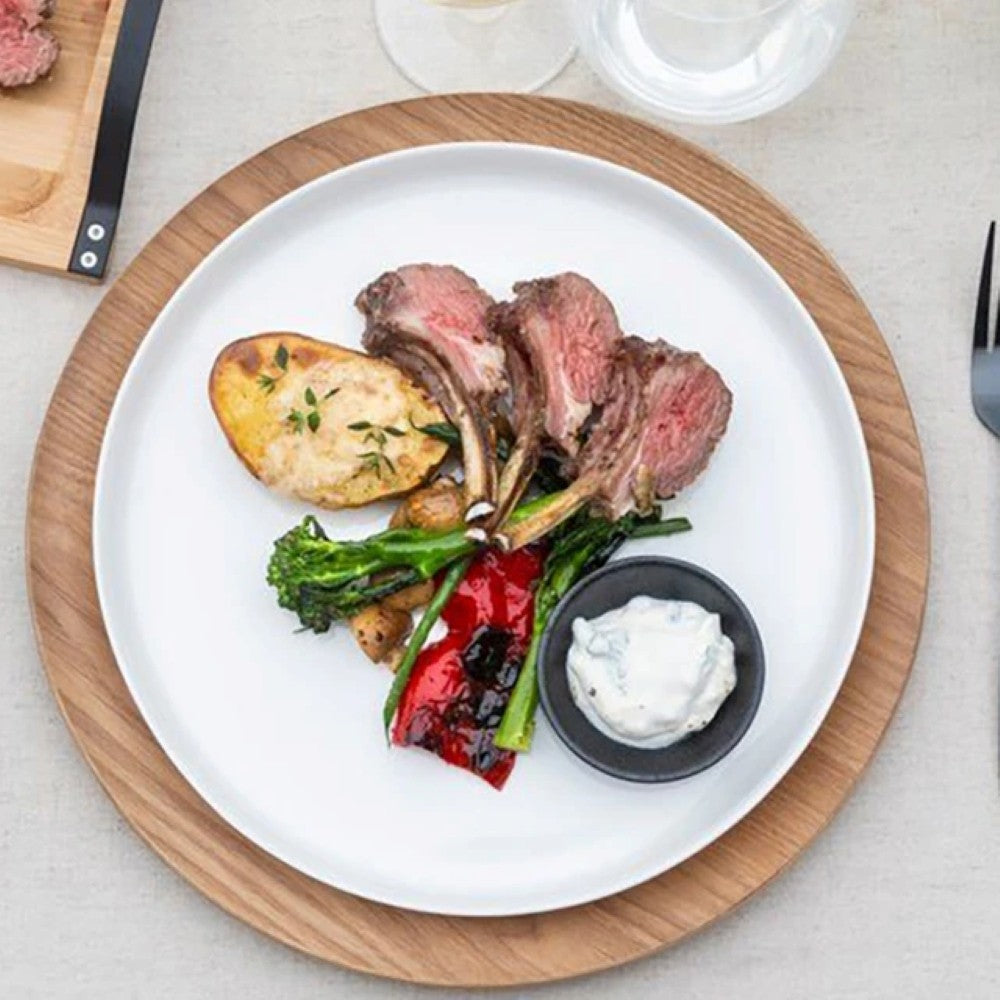 aelgmark wooden round serving tray with a simple, warm Scandinavian design. Perfect for displaying food or decor.